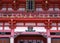 Japanese red, gold and white entrance architecture of temple with handrail details