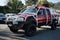 Japanese red pickup truck Nissan Navara parked outside