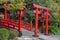 The Japanese red wooden Torii with garden in background at Umi Jigoku PondBlue sea water Hell is one of eight Beppu hot spring
