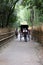 Japanese rickshaw driver carrying a couple