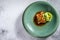 Japanese salmon fish fillet glazed in teriyaki sauce with avocado. Gray background. Top view. Copy space