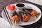 Japanese Salmon temaki sushi, ginger and sauce closeup. horizontal
