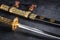 Japanese samurai katana sword and scabbard close up. Photo of a weapon in low key