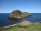 Japanese seaside coast with rocky island and blue sea water