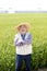 Japanese senior man, farmer in front of rice field