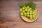 Japanese Shine Muscat Grape in basket  on wooden Background, Sweet Green grape on wooden background.