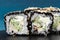 Japanese square rolls with black tobiko roe, sesame seeds, cream