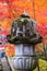 Japanese stone lantern with colorful leaves background in Eikando temple or Eikan-do Zenrinji shrine, famous for tourist