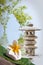 Japanese stone lantern, frangipani flower