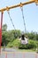 Japanese student girl on the swing appearance from behind