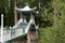 Japanese Style Footbridge Spanning a River in a Public Country Park