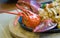 Japanese style lobster steak served on a hot pan with buttered  vegetables as a side dish