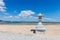 Japanese style stone lamp in white sand beach in Aoshima island, Miyazaki, Japan