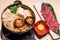 Japanese sukiyaki hot pot with vegetable, beef slice, raw egg