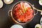 Japanese sukiyaki hot pot with vegetable, beef slice, raw egg cooking in hot pot