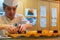 Japanese sushi chef prepares dishes of traditional sushi