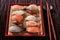 Japanese sushi food various assortment red bamboo tray chopsticks