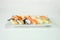 Japanese sushi nigiri of Salmon, Shrimp, Saba, Tako, Squid, Engawa on ceramic plate