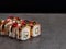 Japanese sushi roll with black tiger shrimp, salmon, eel, rockfish on Concrete background