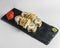 Japanese Sushi Roll - Warm Sushi Roll with Salmon and Cream Cheese served on a black board over white background
