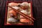 Japanese sushi various assorted platter red bamboo tray chopsticks