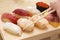 Japanese sushi on wooden board called `Geta`.