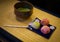 Japanese sweets and green tea that has been placed on the tatami