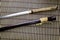 Japanese sword katana and sheath on bamboo mat