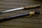 Japanese sword katana and sheath on bamboo mat