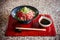 Japanese Tataki raw beef cuisine with ginger, onion, spring onion and soy sauce set on red wooden tray