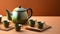Japanese teapot with hot tea and cups.