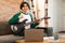 Japanese Teen Guy Playing Guitar Gesturing Thumbs Up At Home