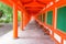 Japanese temple painted orange walkway with seating benches