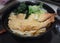 Japanese Tempura shrimps ramen noodle in black bowl