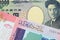 A Japanese thousand yen note paired with a colorful fifty pound bank note from Sudan.