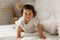 Japanese Toddler Infant Girl Crawling Looking At Camera In Bedroom