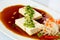 Japanese tofu soft cold with sauce in a dish