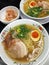 Japanese Tonkotsu ramen noodles in pork broth soup with soft boiled egg