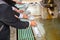 Japanese and tourist cleaning hand at holy water stone basin in front of shrine in japan shinto zen culture