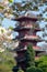 Japanese Tower or Pagoda in the grounds of the Castle of Laeken, the home of the Belgian monarchy, cherry blossom in foreground.