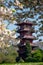 Japanese Tower or Pagoda in the grounds of the Castle of Laeken, the home of the Belgian monarchy, cherry blossom in foreground.