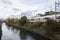 Japanese train travel along the river in Kyoto