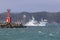 Japanese tuna Boat escaping a Typhoon by coming into port with a wonderful rainbow in the sky.