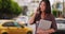 Japanese university student standing by the street waiting for a ride