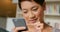 Japanese woman, phone and texting in closeup with search, reading or web blog with connection in home. Person