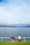 Japanese woman standing by lake Toya shore with Nakajima island