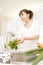 Japanese woman washing a vegetable