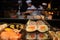Japanese workers prepare Sushi rolls