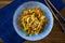 Japanese yaki udon in a blue bowl