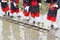 Japanese young girls plants in a rice paddy